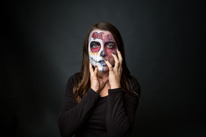 Young woman with creepy face paint