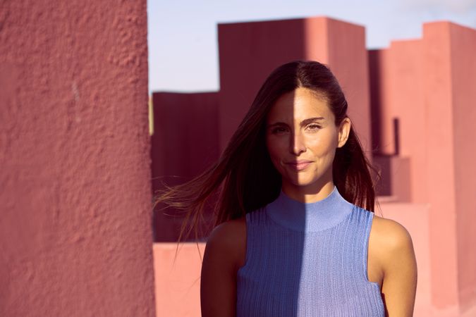 Woman looking at camera in sunlight