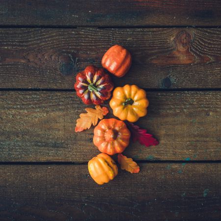 Creative autumn Halloween layout with various leaves and pumpkins