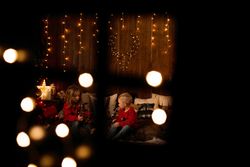 Siblings playing in a room with christmas decoration