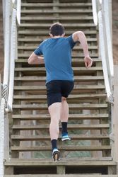 Sportsman running on stairs