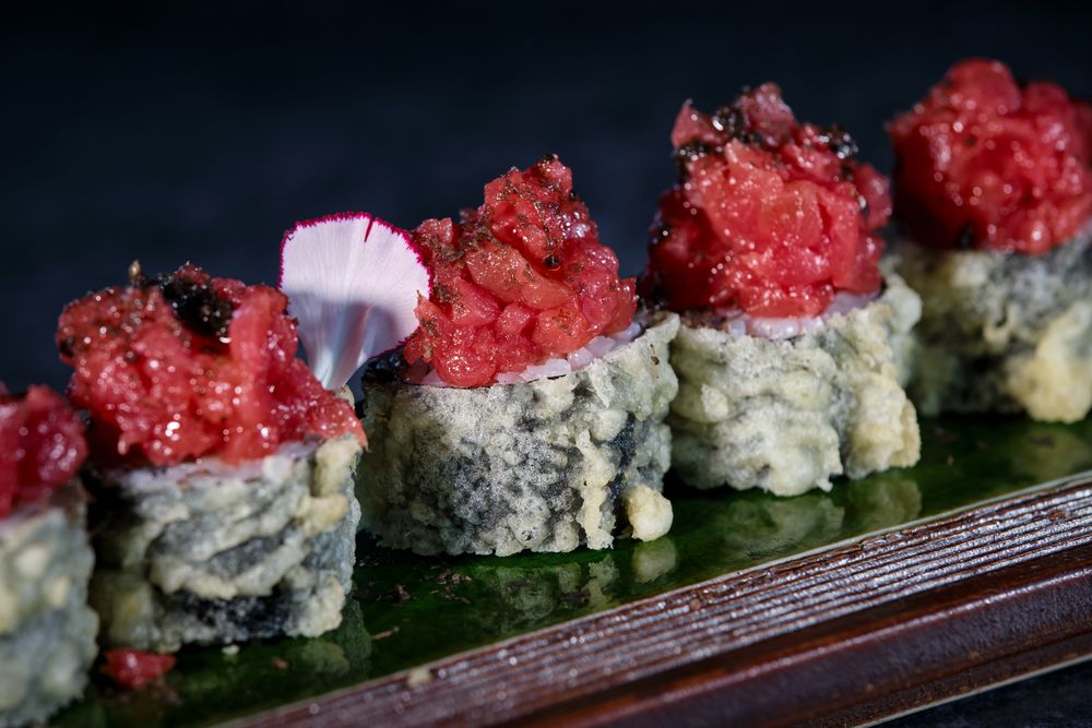 Delicious uramaki sushi rolls with raw tuna