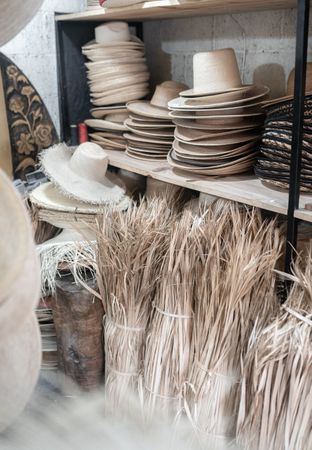 Some palm tree fiber stacks in a hat workshop