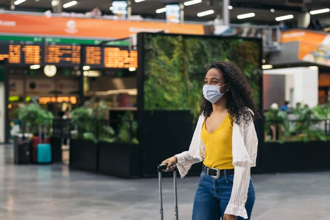 Black young woman meeting her boyfriend after a trip