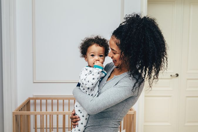 Beautiful mother with son in living room
