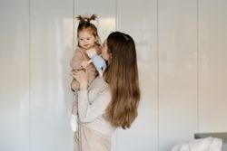 Mother holding toddler
