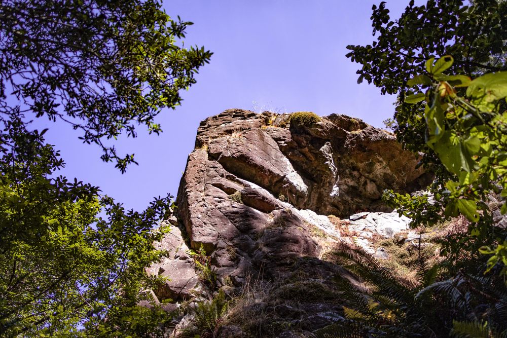 Looking up at rock with blue sky