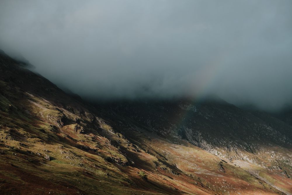 Rocky hills covered by mist in Scotland