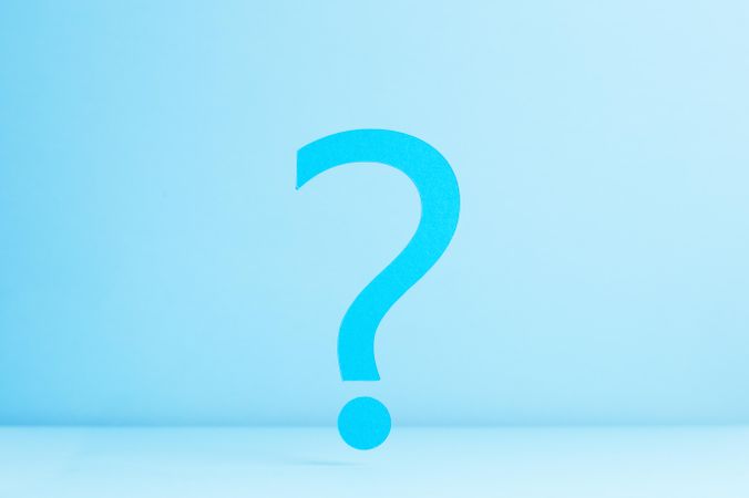 Blue question mark on blue background