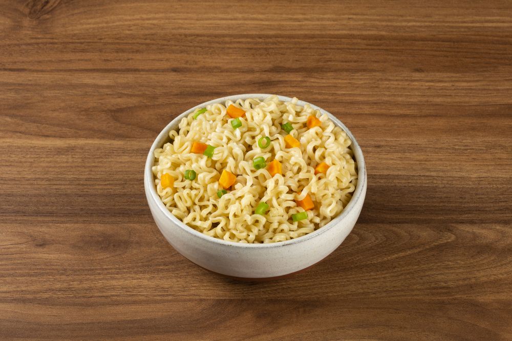Bowl with instant noodles on the table.