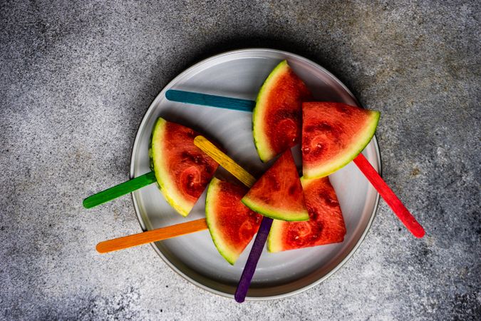 Watermelon popsicle on plate