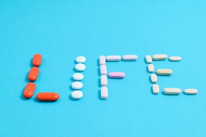 Variation of pills making the word "LIFE"