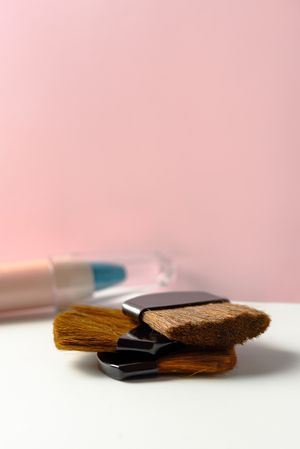 Cosmetic pencils:, make up blue eyeliner pencil, modern background with pink chevron reliefs. make up concept
