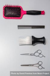 Hairdressing styling tools laid out on table bYAEjb