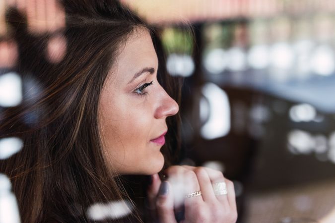 Woman looking through window