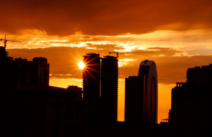City evening landscape with sunset. Sunset is in the town.