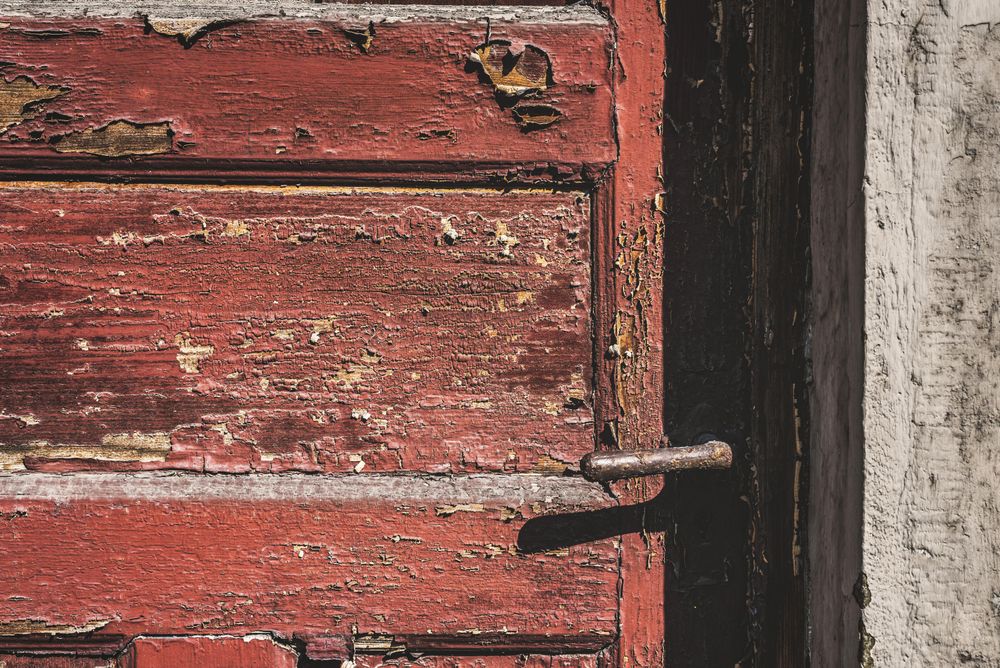 Close up of Rusty and cracked paint door