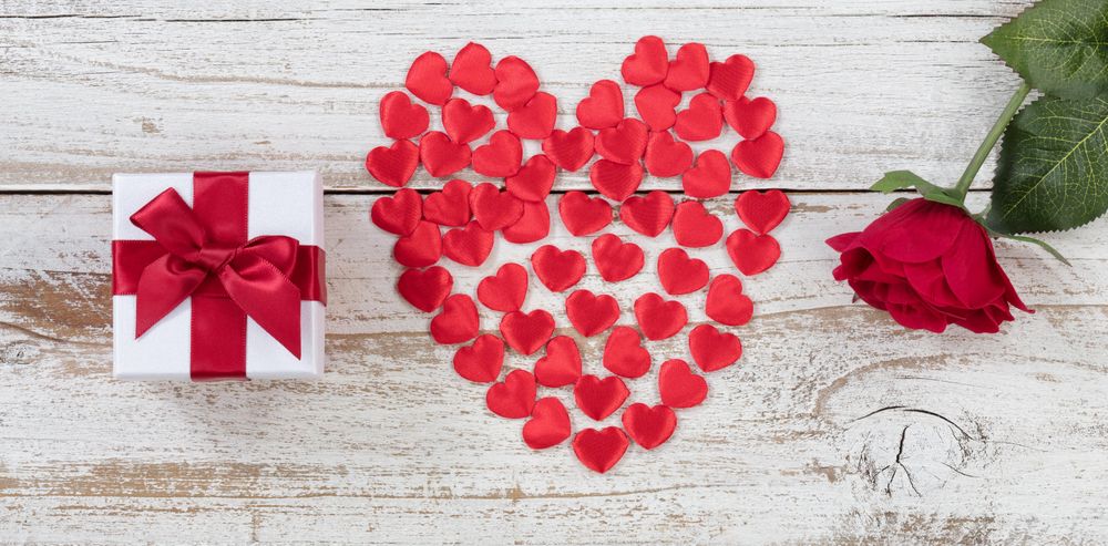 Valentine’s Day love objects on rustic wood