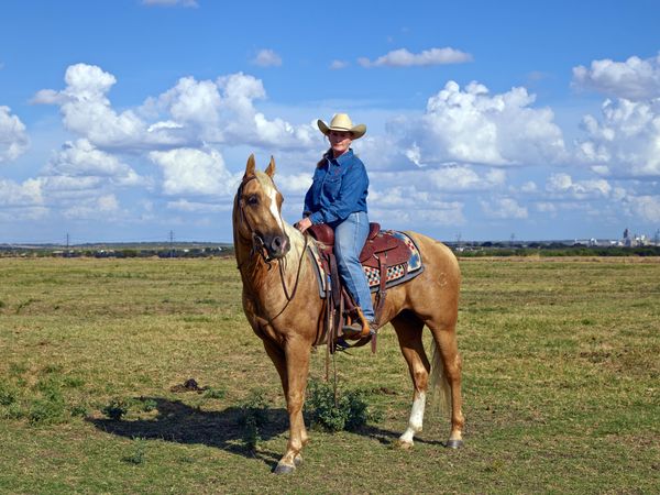 Woman on horseback at Cannon Quarter Horse Ranch near Venus, Texas