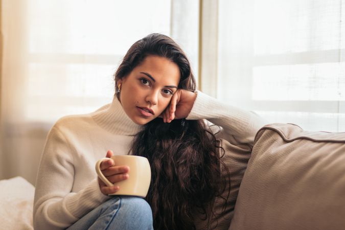 Enjoying Morning at Home: Young Woman Drinking Coffee