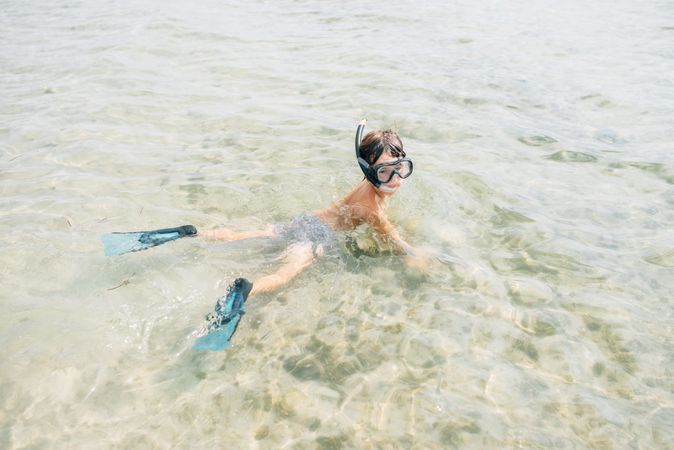 Kid swimming in diving mask