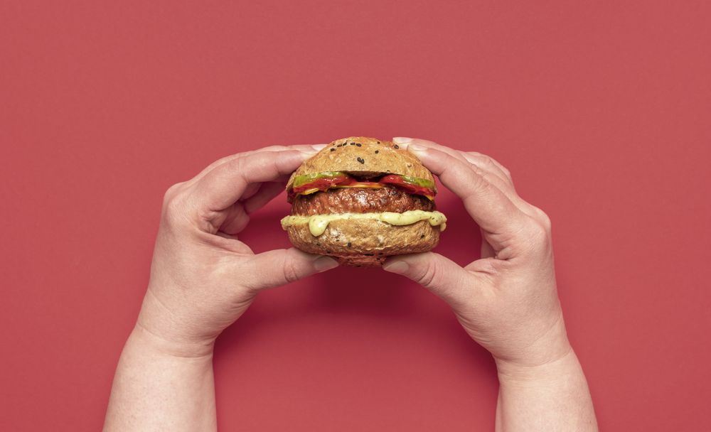 Vegan burger above view on a red table