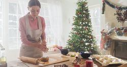 Portrait of Female Chef Preparing Dough and Making Gingerbread for Christmas at Home.
