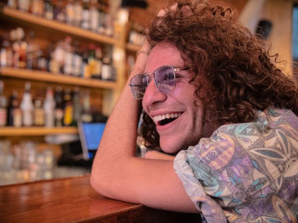 Portrait of man smiling at the bar