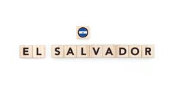 Wooden blocks bearing the name and flag of El Salvador . Salvadoran and American Culture, national identity, travel, and geography in a copy space design.