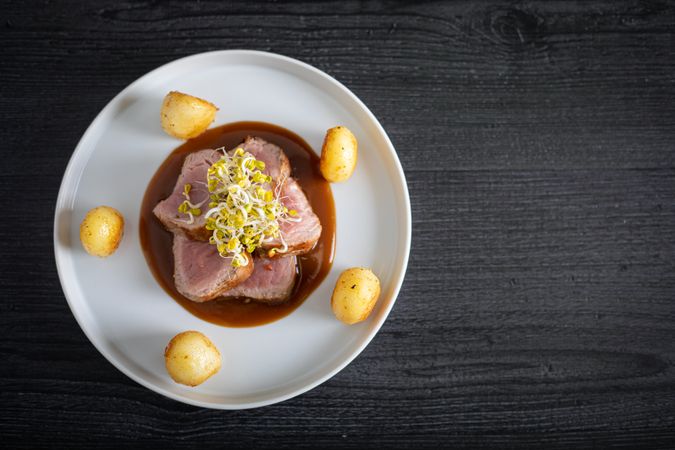 Duroc sirloin with orange ginger soy and potatoes