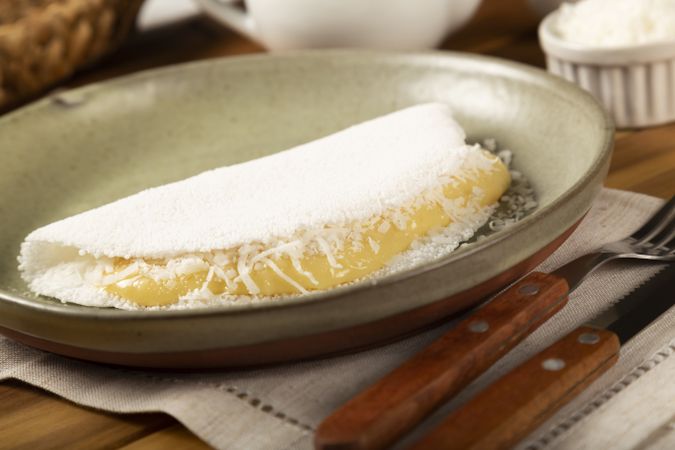 Sweet tapioca stuffed with coconut cream. Brazilian tapioca.