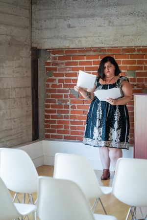 Woman going over her notes before a talk