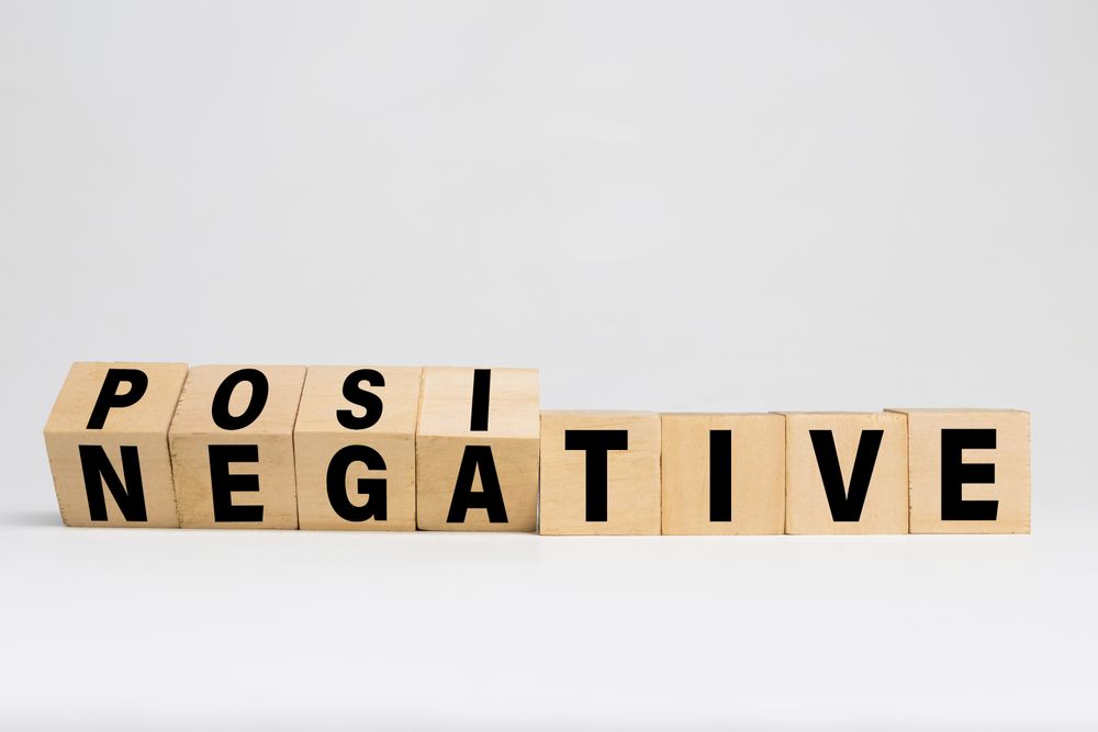 flip wooden blocks with positive and negative words