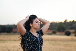 Portrait of a woman with long hair in the countryside