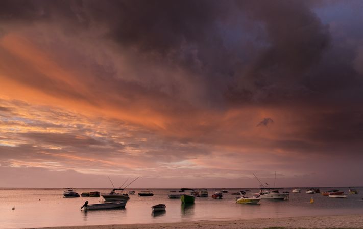 Boats anchored at sunset in Indian Ocean