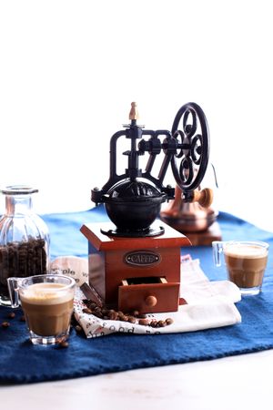 Vintage Coffee Grinder with Coffee Beans in a Bottle